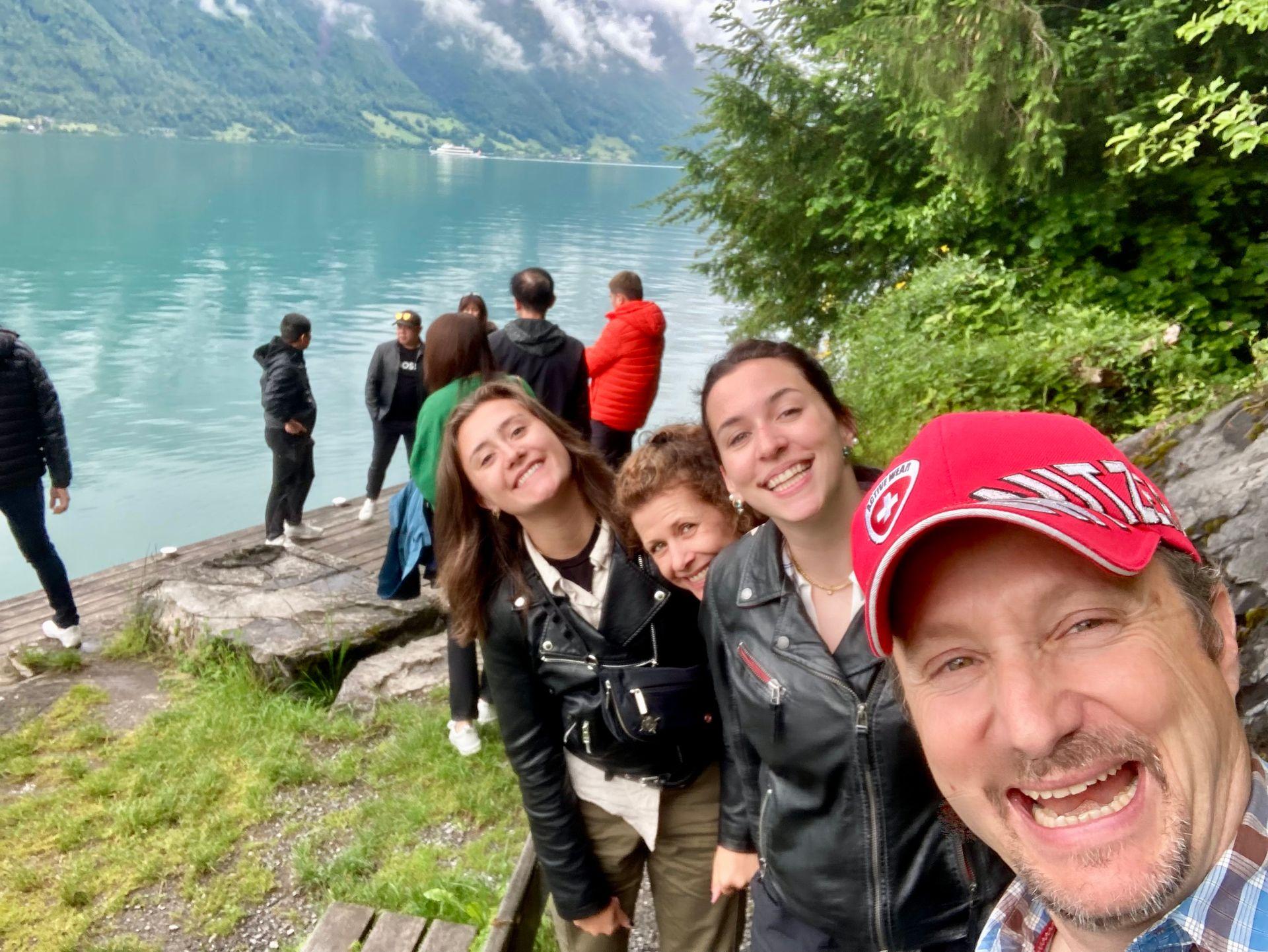 Happy group of travelers with DaCapo Travel - Lake Brienz